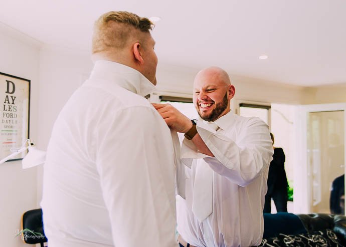 Groom and Groomsmen getting ready pre-wedding at Lake House, Day