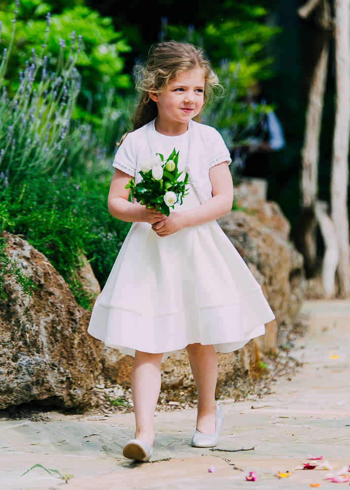 Flowergirl walking down the aisle at Lake House, Daylesford