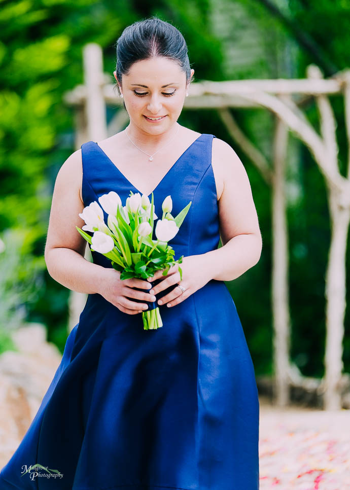 Bridesmaid walking down the aisle at Lake House, Daylesford