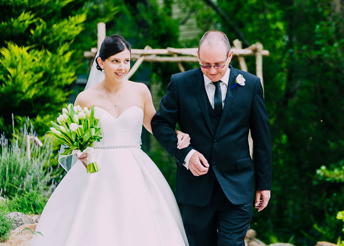 Bride walking down the aisle with her father at a Lake House, Da