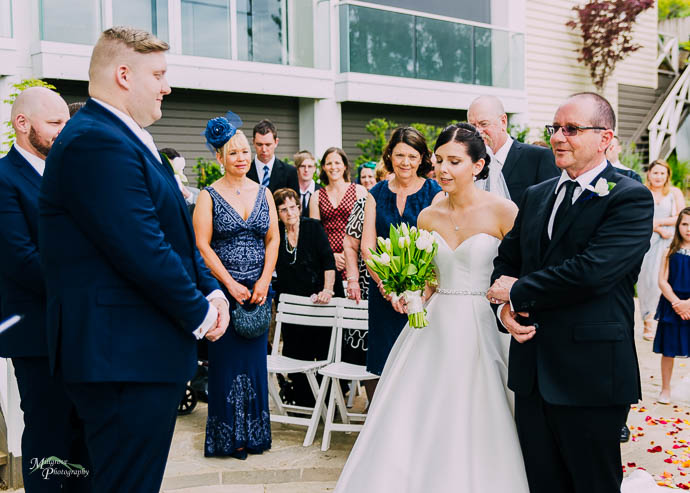 Bride walking down the aisle with her father at a Lake House, Da
