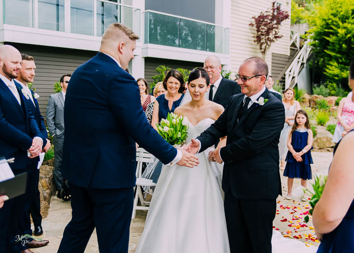 Groom and Bride’s father shaking hands at a Lake House, Dayles