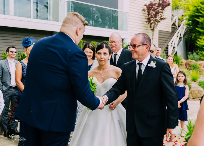 Groom and Bride’s father shaking hands at a Lake House, Dayles