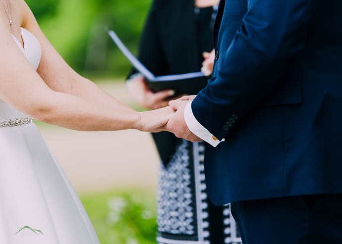 Bride and Groom holding hands