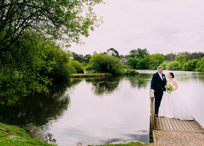 Bridal party by the lake at Lake House, Daylesford