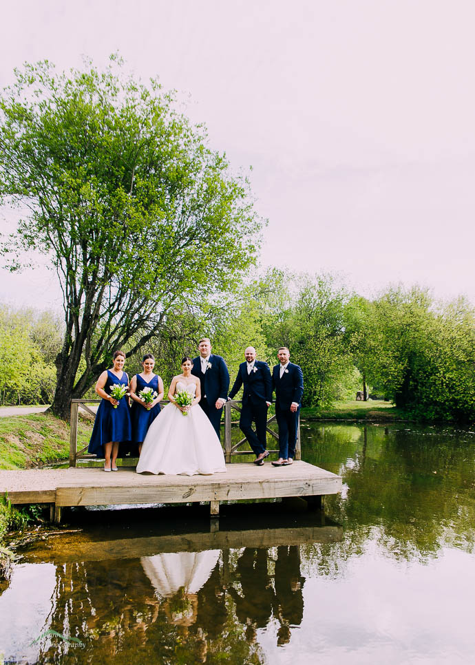 Bridal party by the lake at Lake House, Daylesford