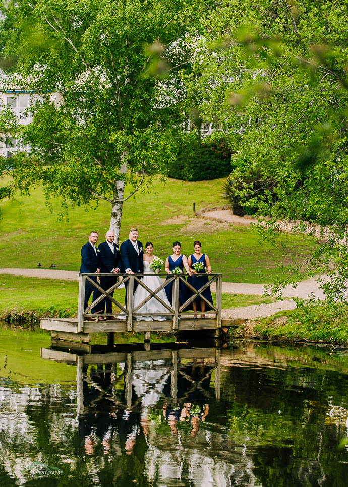 Bridal party by the lake at Lake House, Daylesford