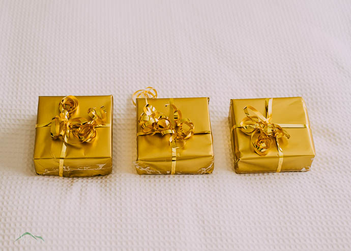 3 presents wrapped in gold