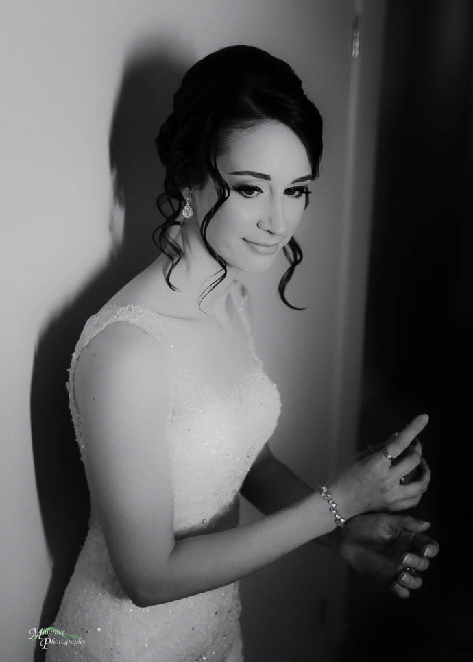 Bride putting on perfume