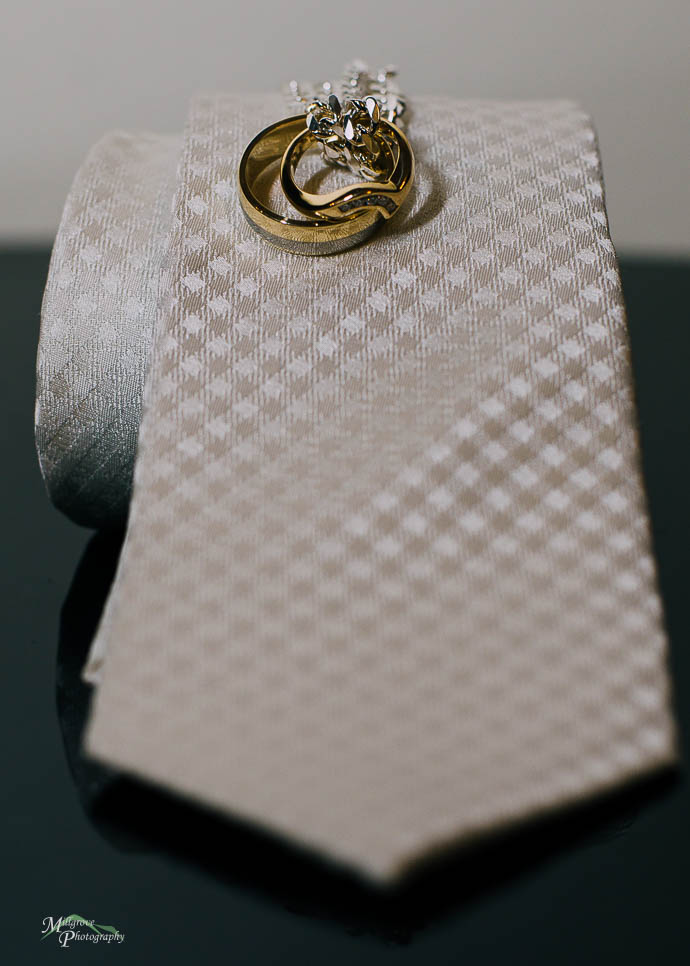 Tie with rings on it, with a necklace through them