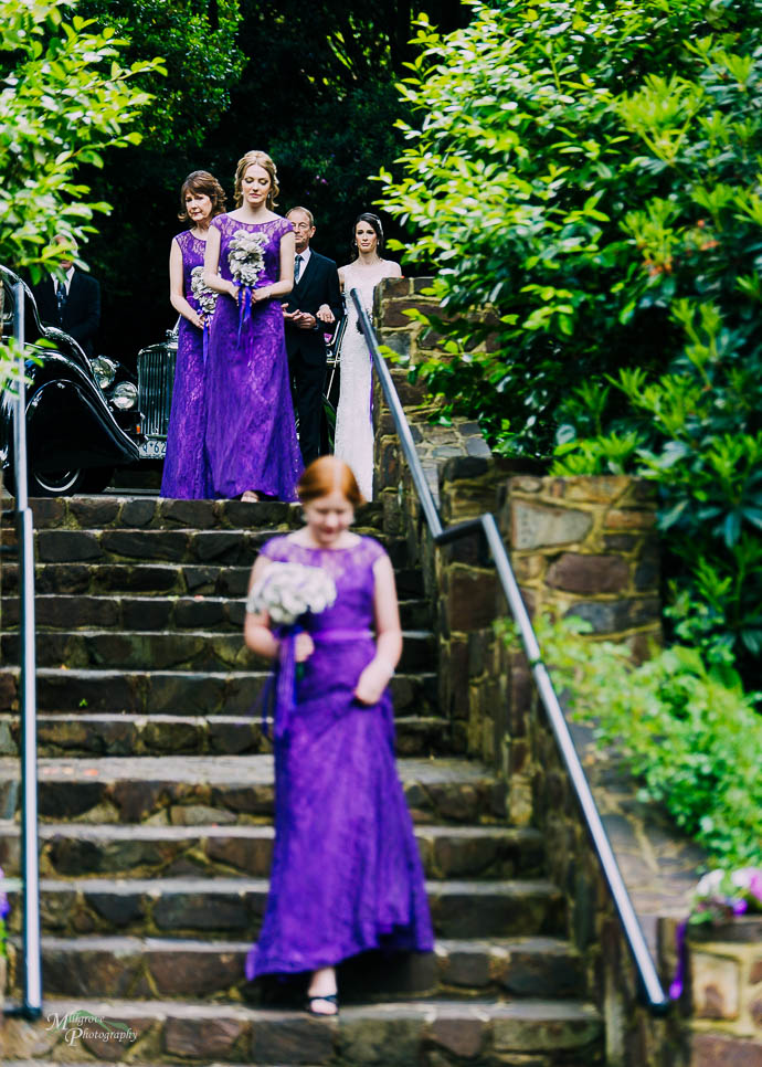 Bridesmaids walking down the steps at Marybrooke Manor, Sherbrooke