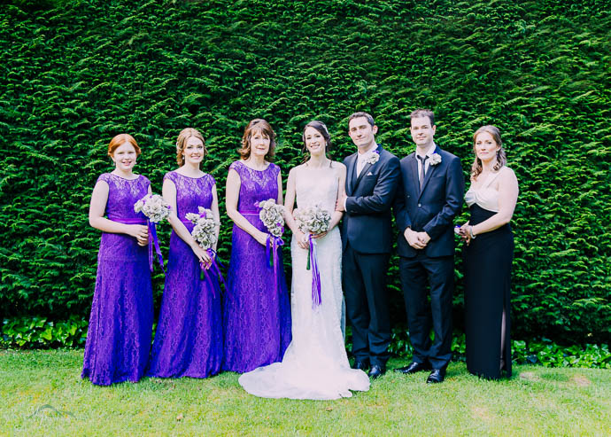 Bridal party in front of hedge at Marybrooke Manor, Sherbrooke