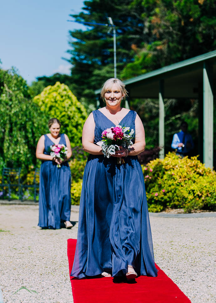 Bridesmaids walking down the aisle at Warburton Golf Club
