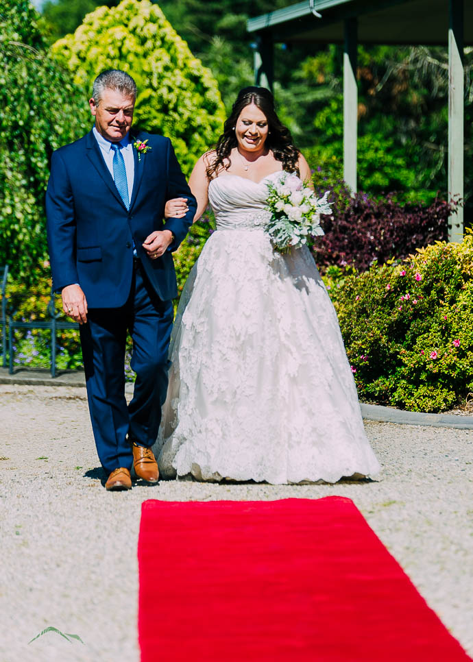 Bride walking down the aisle with her Dad at Warburton Golf Club