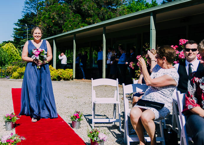 Bridesmaids walking down the aisle at Warburton Golf Club