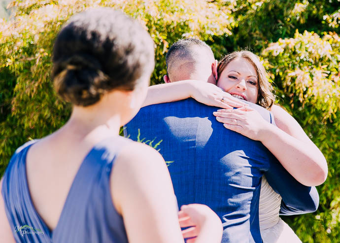 Bride hugging her brother