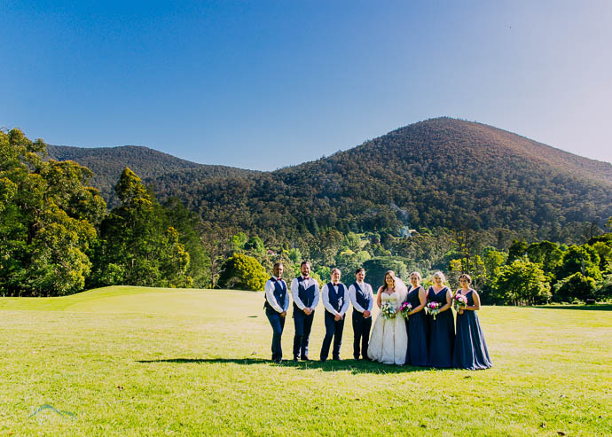 Bridal party with a mountain view in the background at Warburton Golf Club