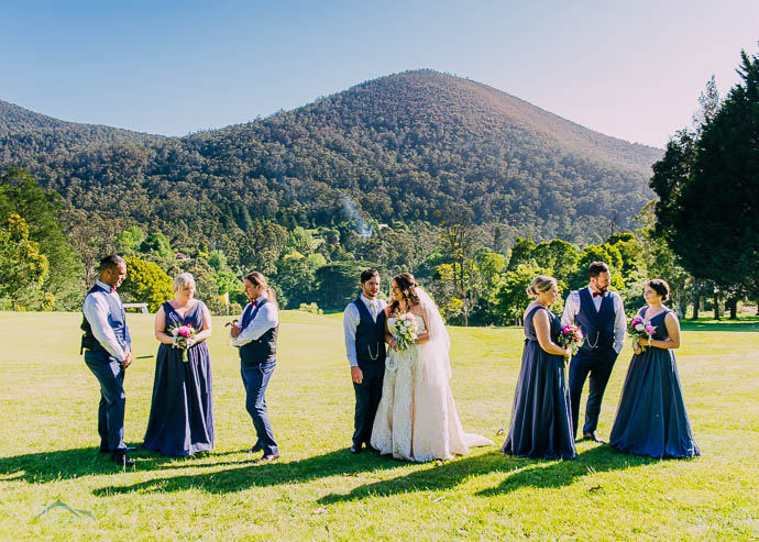 Bridal party with a mountain view in the background at Warburton Golf Club