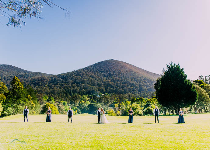 Bridal party with a mountain view in the background at Warburton Golf Club