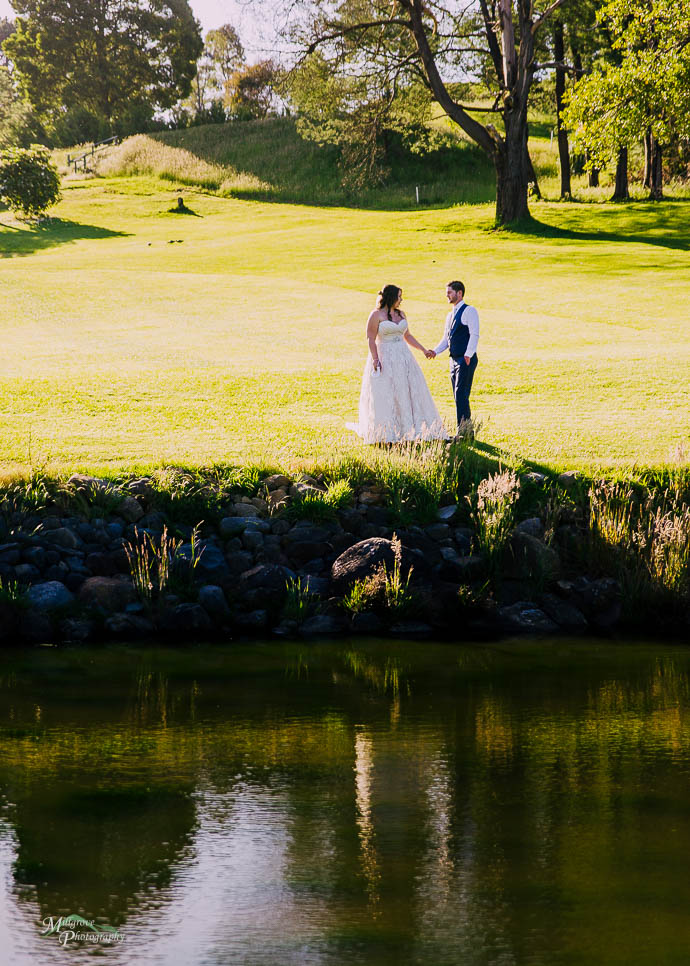 Bride and Groom by the lake at Warburton Golf Club