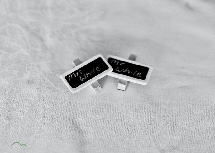 Chalk board names cards at a wedding