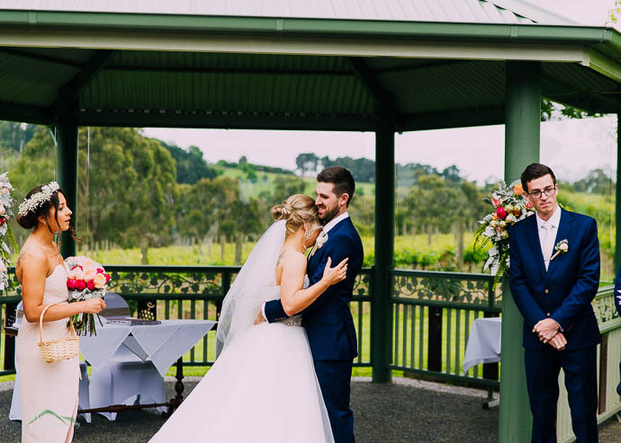 Bride hugging groom