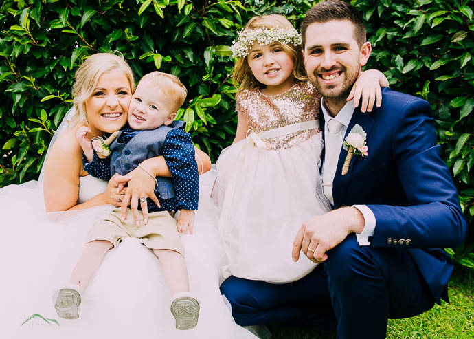 Bride and Groom with their cute kids in a portrait at Wild Cattle Creek Winery