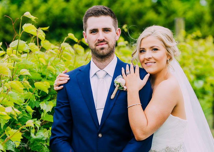 Bride holding Groom’s shoulder at Wild Cattle Creek Winery