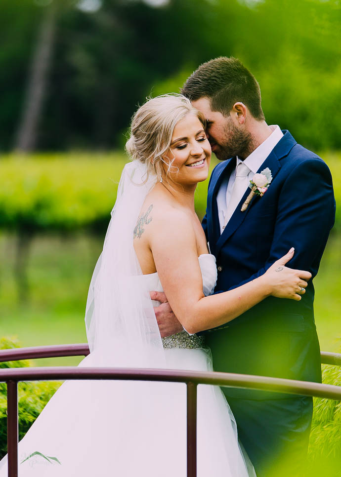 Bride and Groom on the little bridge at Wild Cattle Creek Winery