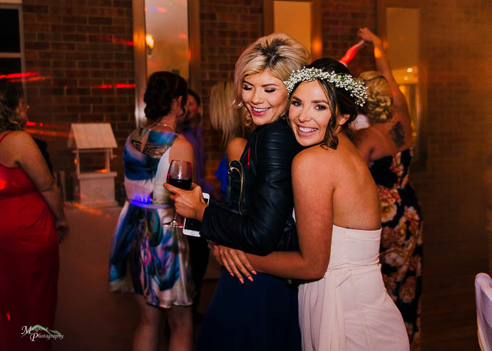 Candid moments of people dancing during the reception at Wild Cattle Creek Winery