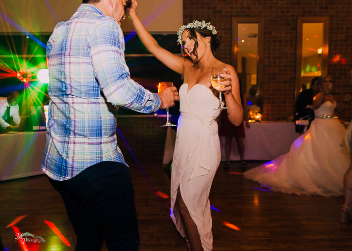 Candid moments of people dancing during the reception at Wild Cattle Creek Winery