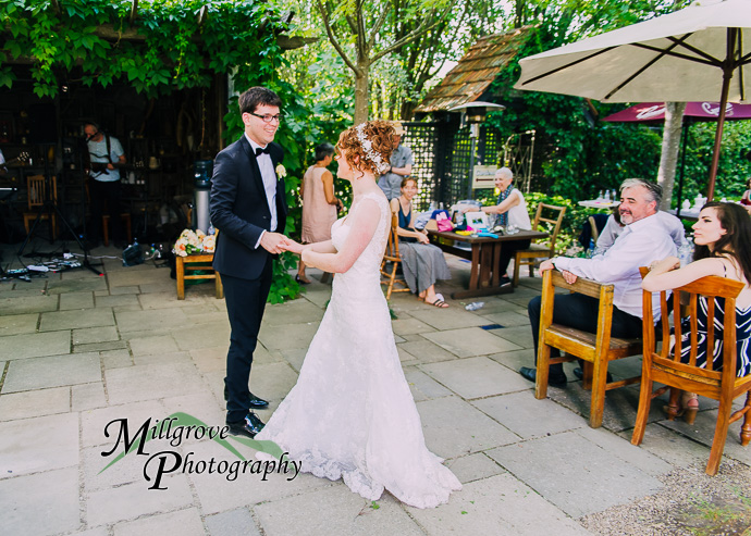 Guests celebrating with the bride and groom at their wedding