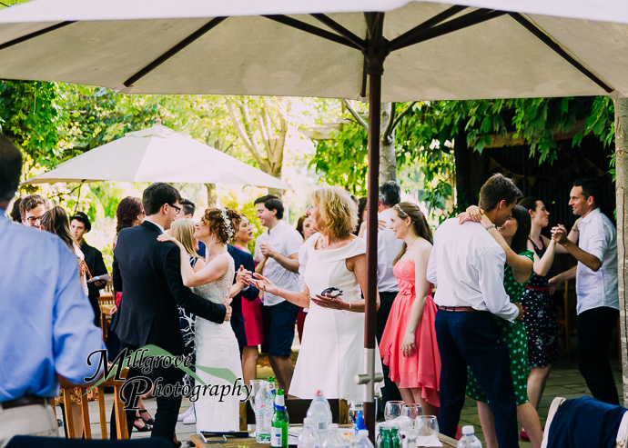 Guests celebrating with the bride and groom at their wedding