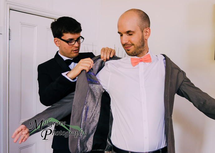 Groom and groomsmen getting ready for a wedding