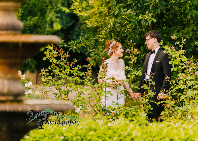 A bride and groom in a garden