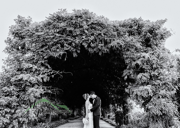 A bride and groom in a garden