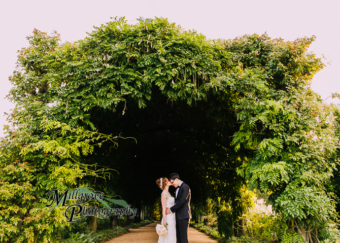 A bride and groom in a garden