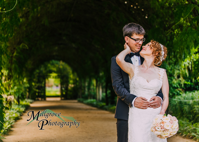 A bride and groom in a garden