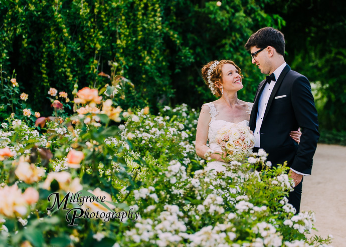 A bride and groom in a garden