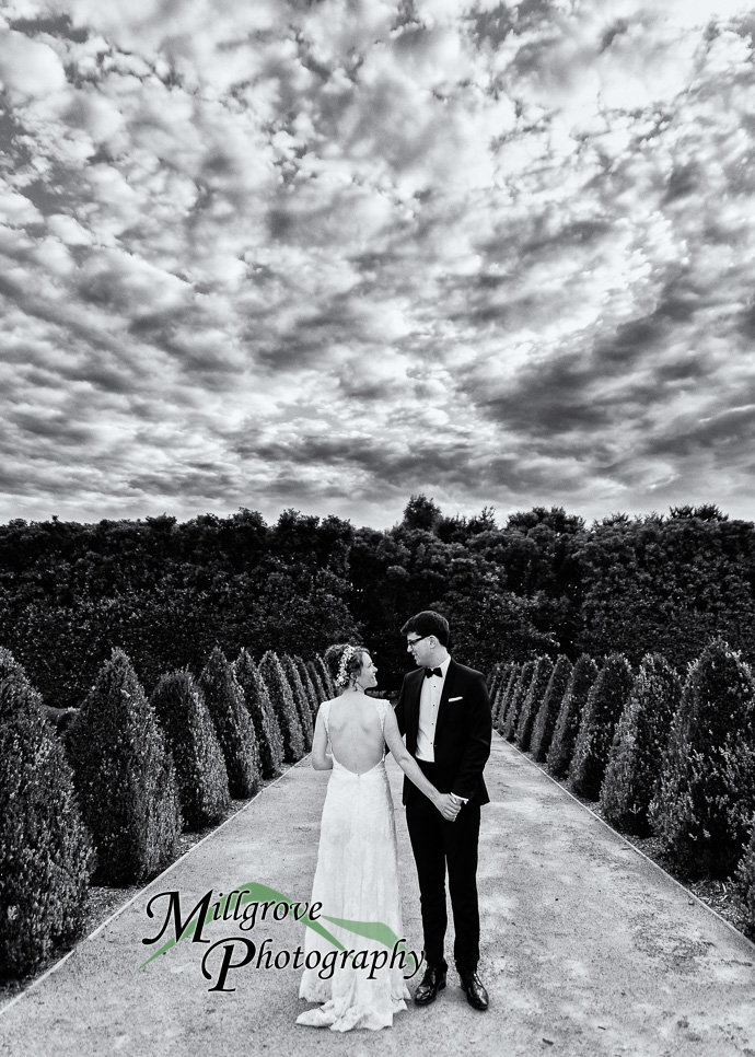 A bride and groom in a garden