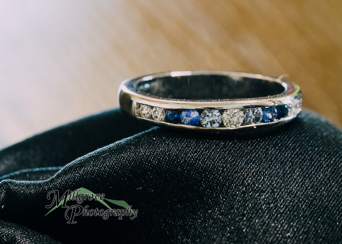 A wedding ring on a black background