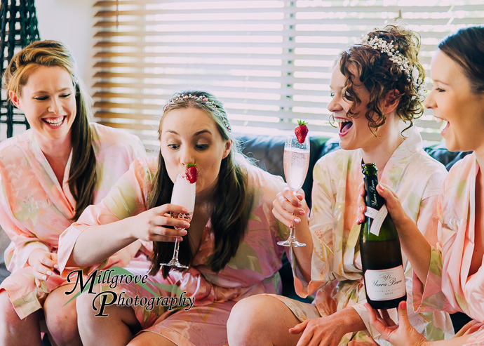 A bride and bridesmaids preparing for a wedding