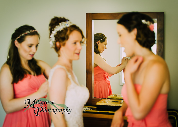 A bride and bridesmaids preparing for a wedding