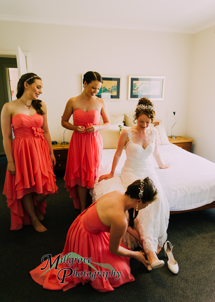 A bride and bridesmaids preparing for a wedding