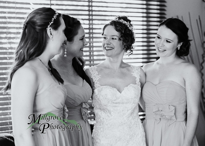 A bride and bridesmaids preparing for a wedding