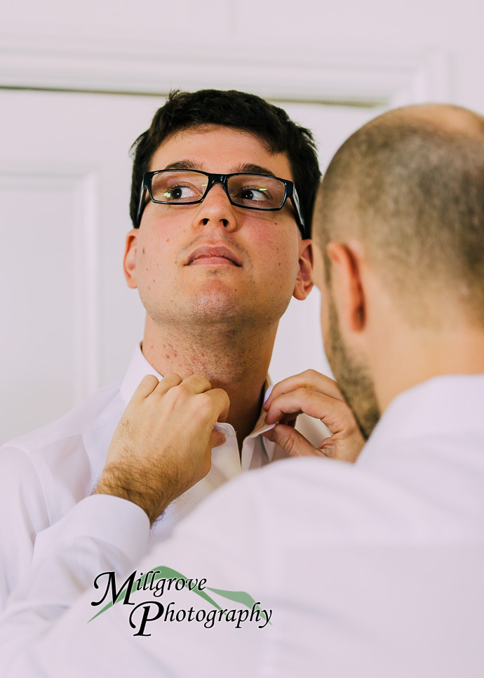 Groom and groomsmen getting ready for a wedding