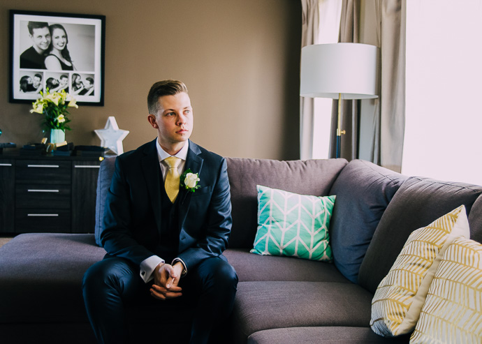 Groom sitting on a sofa