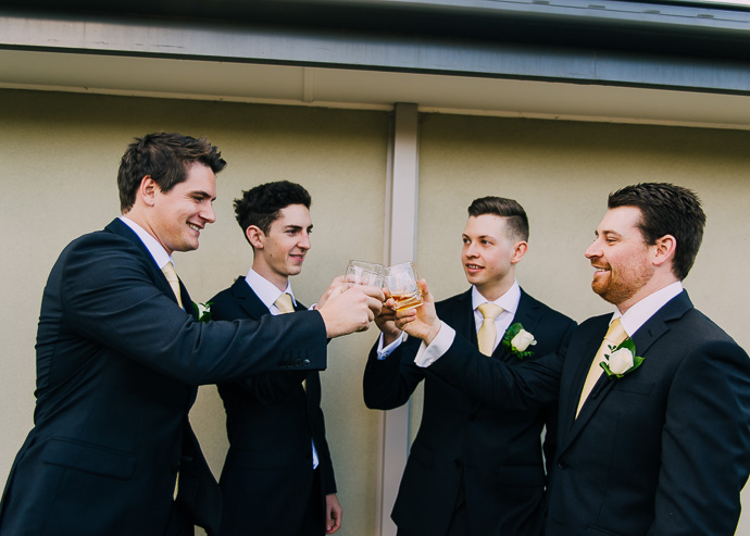 Groom and groomsmen sharing a drink