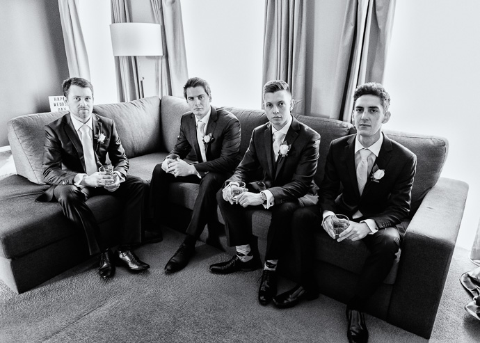 Black and white photo of 4 men