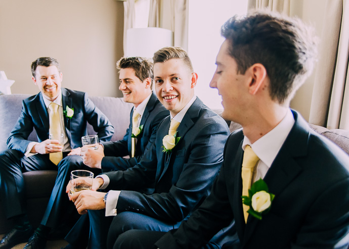 4 men sitting on a sofa